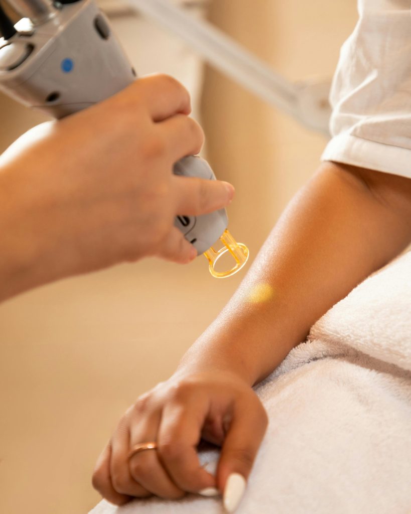 pexels-photo-19239092-19239092 Close-up of a laser hair removal session at a spa, emphasizing professional skincare and relaxation.